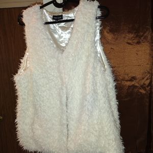 BRAND NEW FUZZY CREAM VEST.SATTIN LINING INSIDE TWO INNER HOOKS TO CLOSE AT TOP